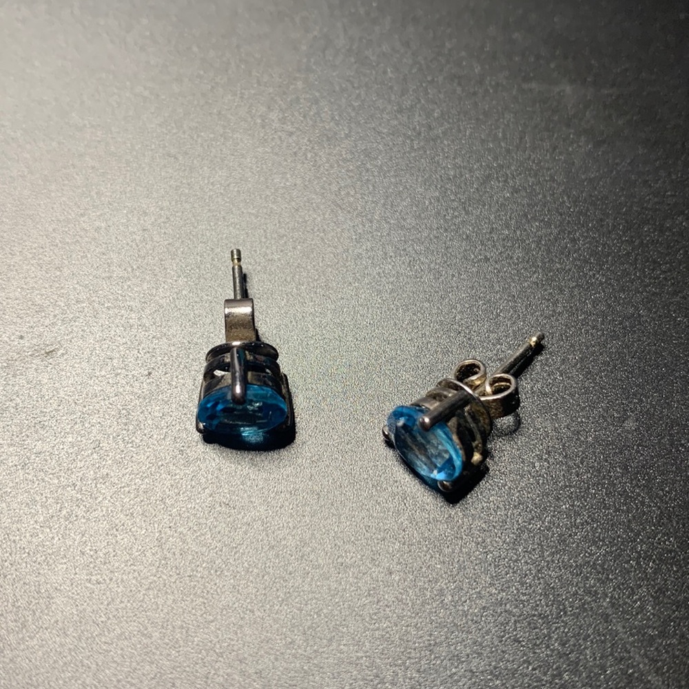 Blue stones on silver studs.